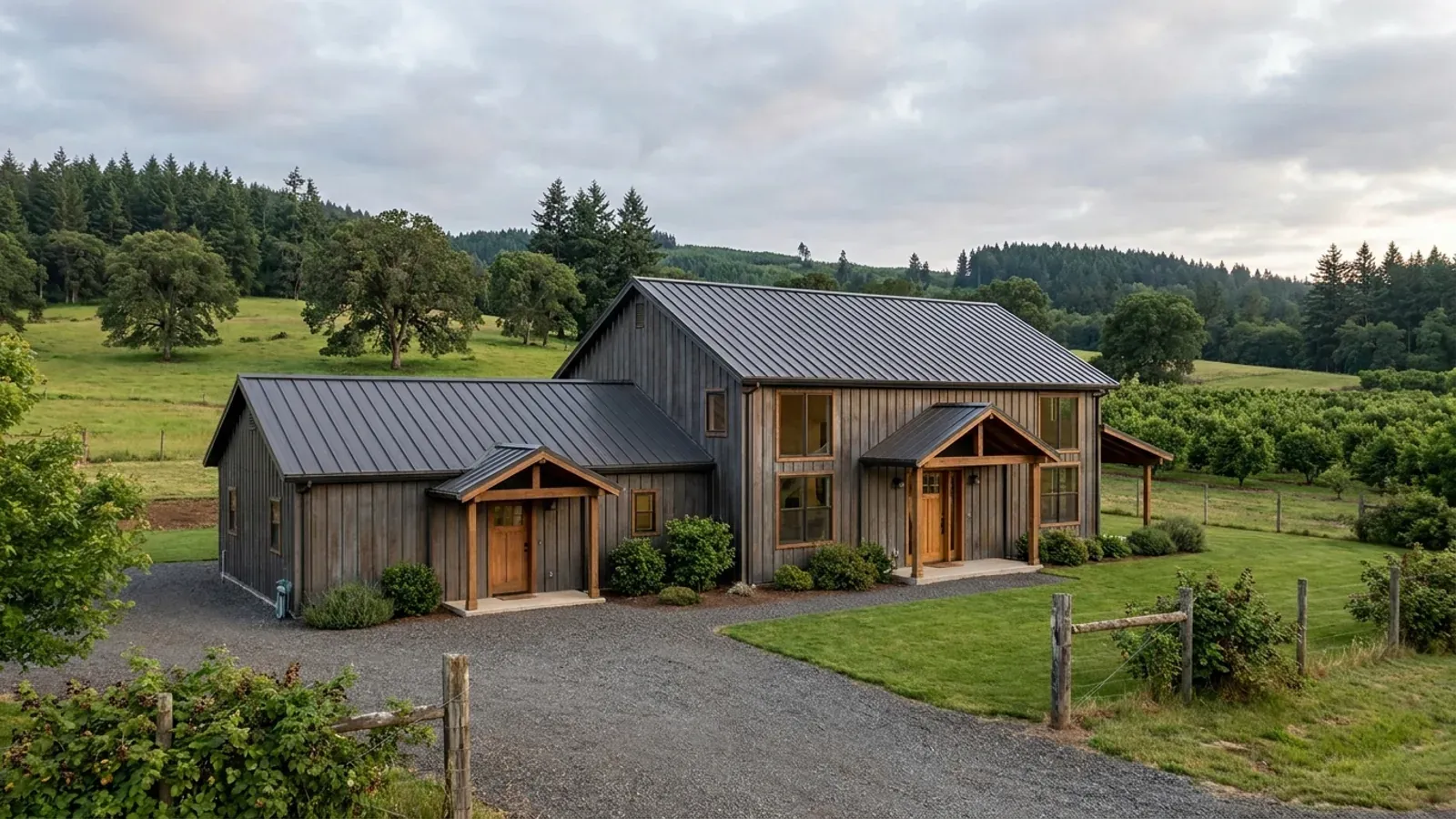 A barndominium with a smaller attached in-law suite wing that has its own separate covered entry, distinct from the main entry.